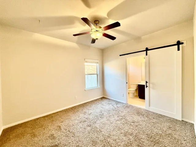 a kitchen with stainless steel appliances a refrigerator sink and microwave