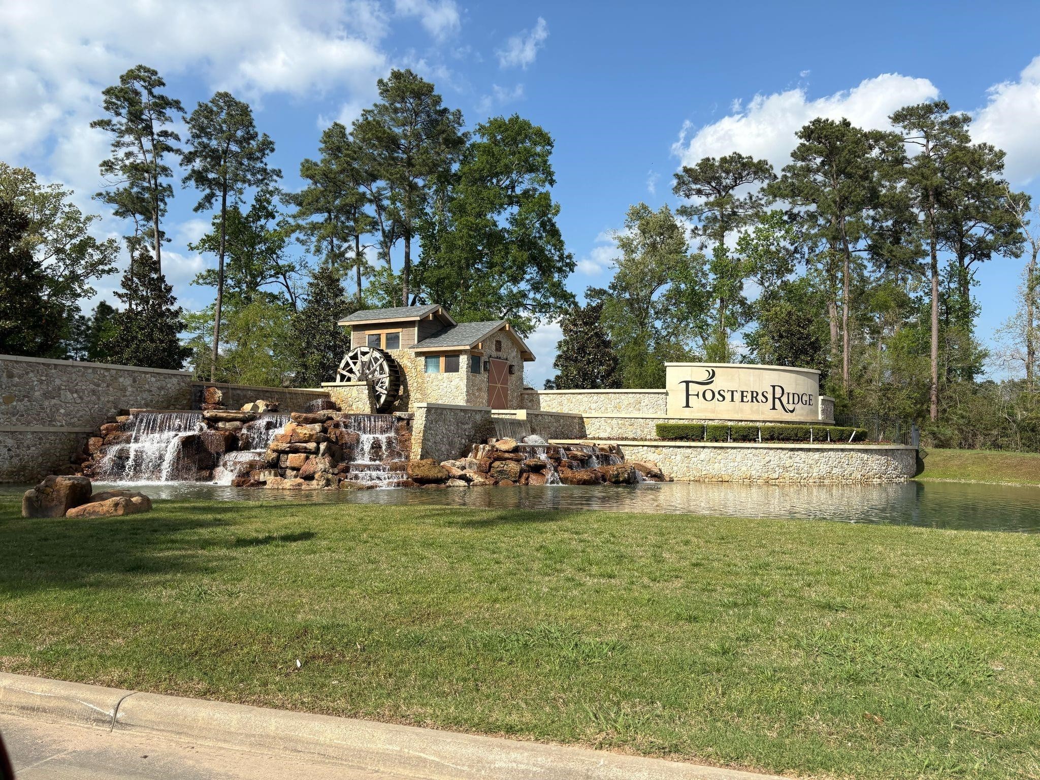 14208 Wallowa Ridge Lane Conroe, TX 77384 - Photo 43 of 48 a view of a park with swings and slides