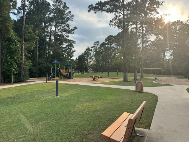 a view of swimming pool with a yard