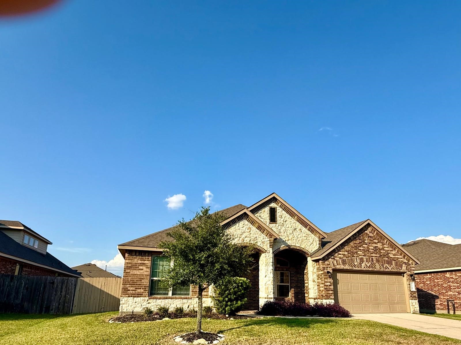 14208 Wallowa Ridge Lane Conroe, TX 77384 - Photo 10 of 48 a front view of a house with a yard