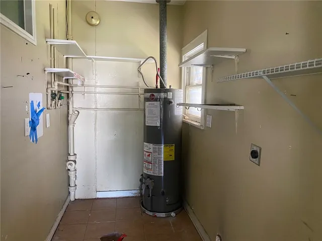 a view of an empty room with wooden walls