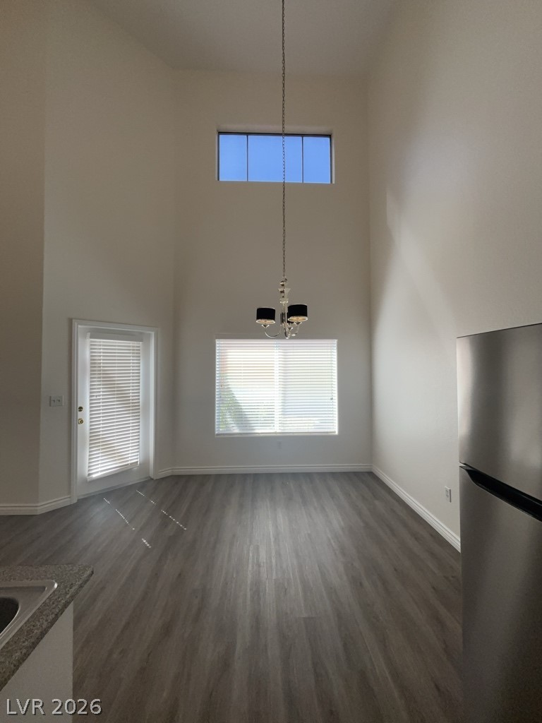 4915 East Russell Road, Unit 154 Las Vegas, NV 89120 - Photo 4 of 20 High ceilings and modern plank flooring define this airy dining area adjacent to the kitchen.