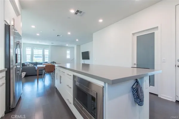 a stove top oven sitting inside of a kitchen