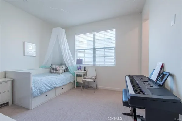 a room that has a bed and a workspace