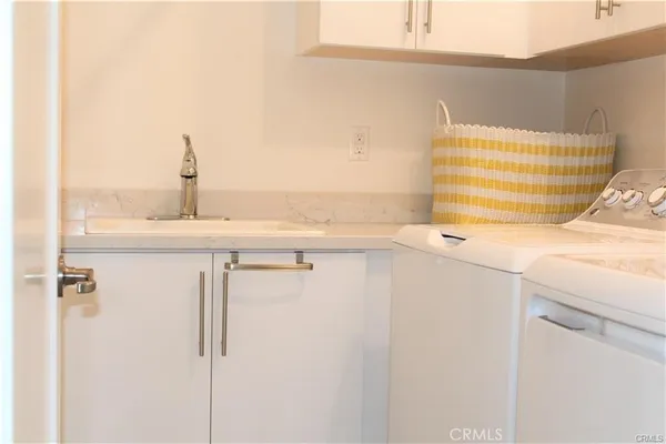 a bathroom with a bathtub and a window