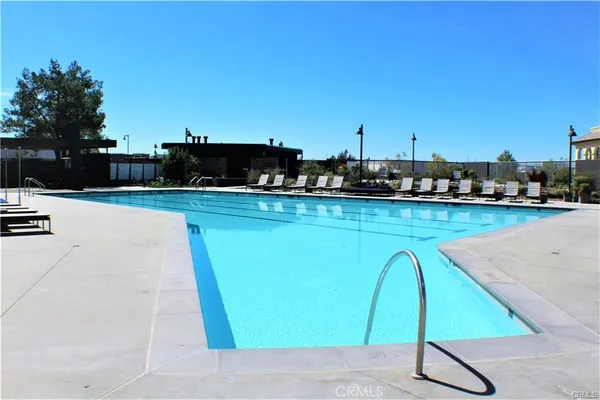 a view of swimming pool with a yard