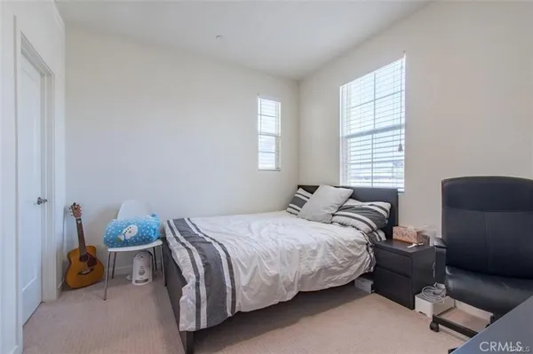 a bedroom with a bed and closet