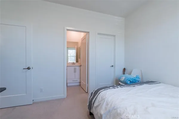 a view of a livingroom with wooden floor and furniture