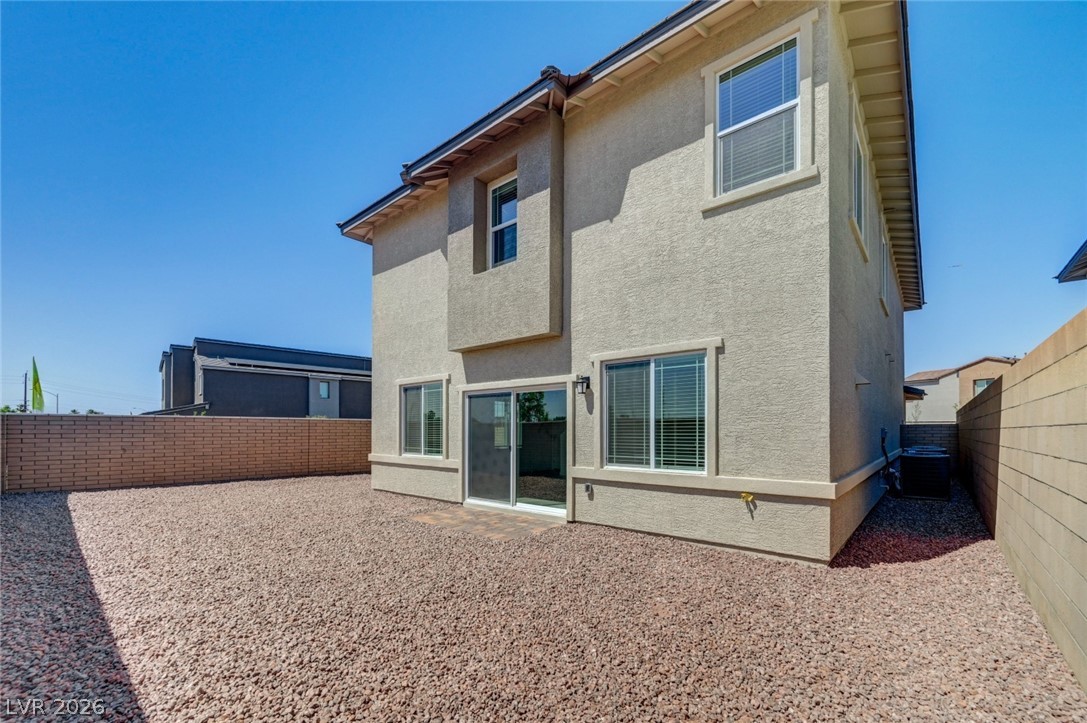345 Isla Enclave Way Henderson, NV 89011 - Photo 73 of 75 This residence features a rock-filled yard, ideal for low-maintenance living and sun-drenched enjoyment.