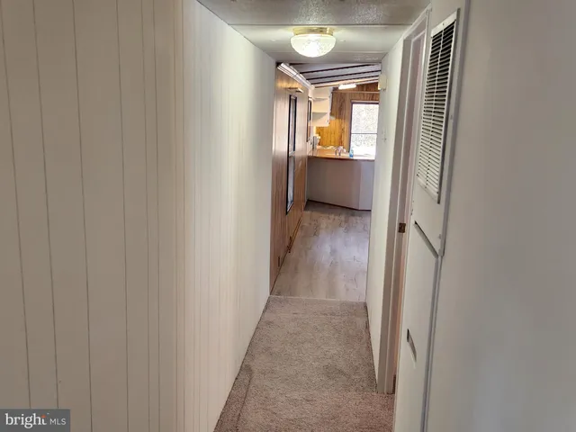 a bathroom with a sink and mirror with toilet