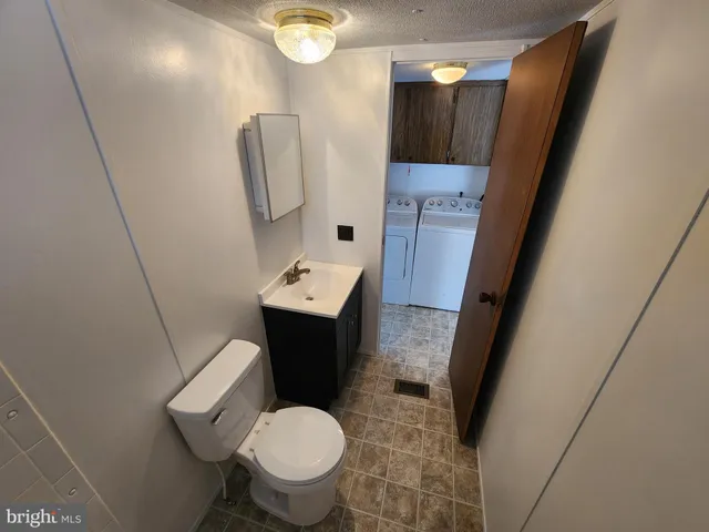a view of a hallway with wooden shelves
