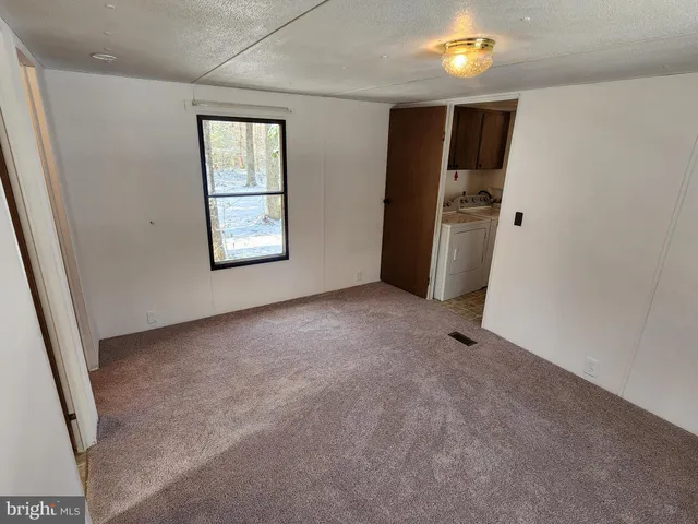 a view of a bathroom from a corridor