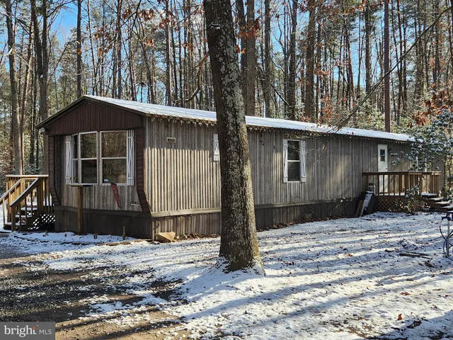 a house with trees in the background