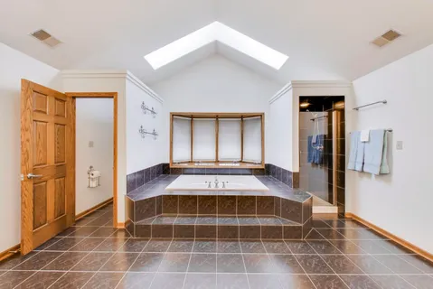 a bedroom with furniture and a wooden floor