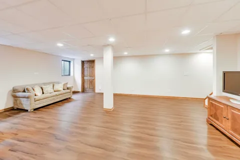 a view of a hallway to closet and wooden floor