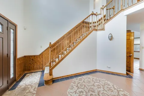 a view of an entryway with wooden floor