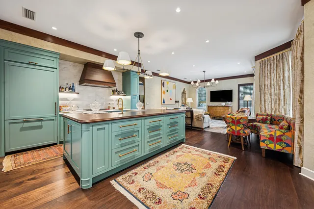 a kitchen with stainless steel appliances a sink and cabinets