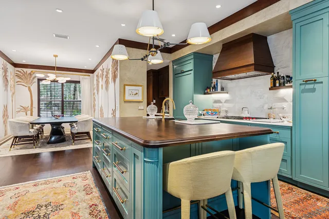 a living room with furniture ceiling fan and a flat screen tv