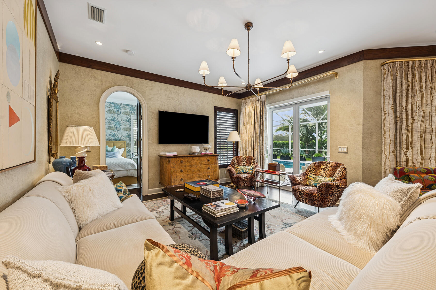 7718 Spring Creek Drive West Palm Beach, FL 33411 - Photo 17 of 72 a living room with furniture ceiling fan and a flat screen tv