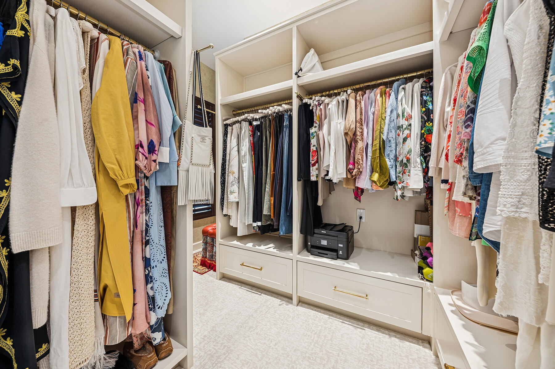 7718 Spring Creek Drive West Palm Beach, FL 33411 - Photo 22 of 72 a view of walk in closet with clothes and shoes