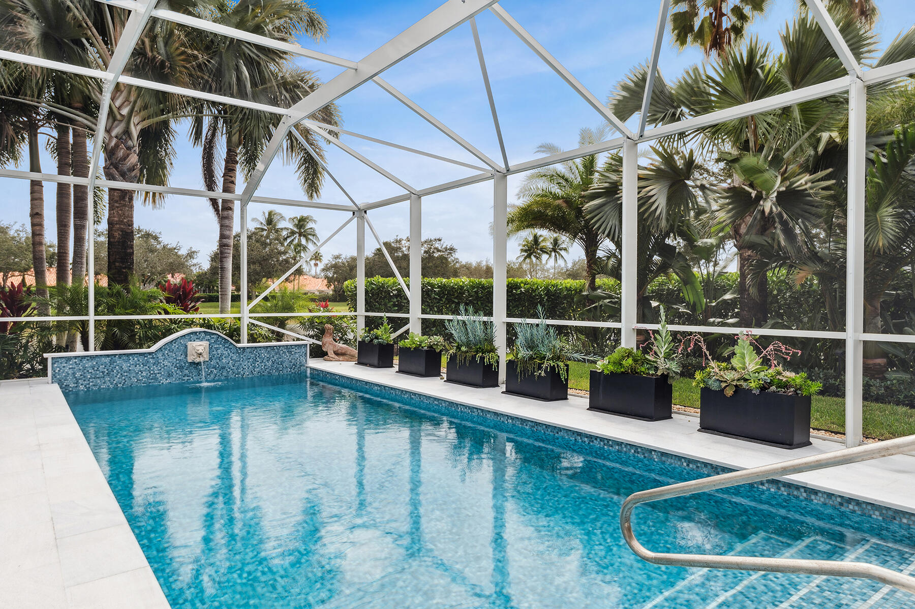 7718 Spring Creek Drive West Palm Beach, FL 33411 - Photo 34 of 72 a view of a house with a backyard