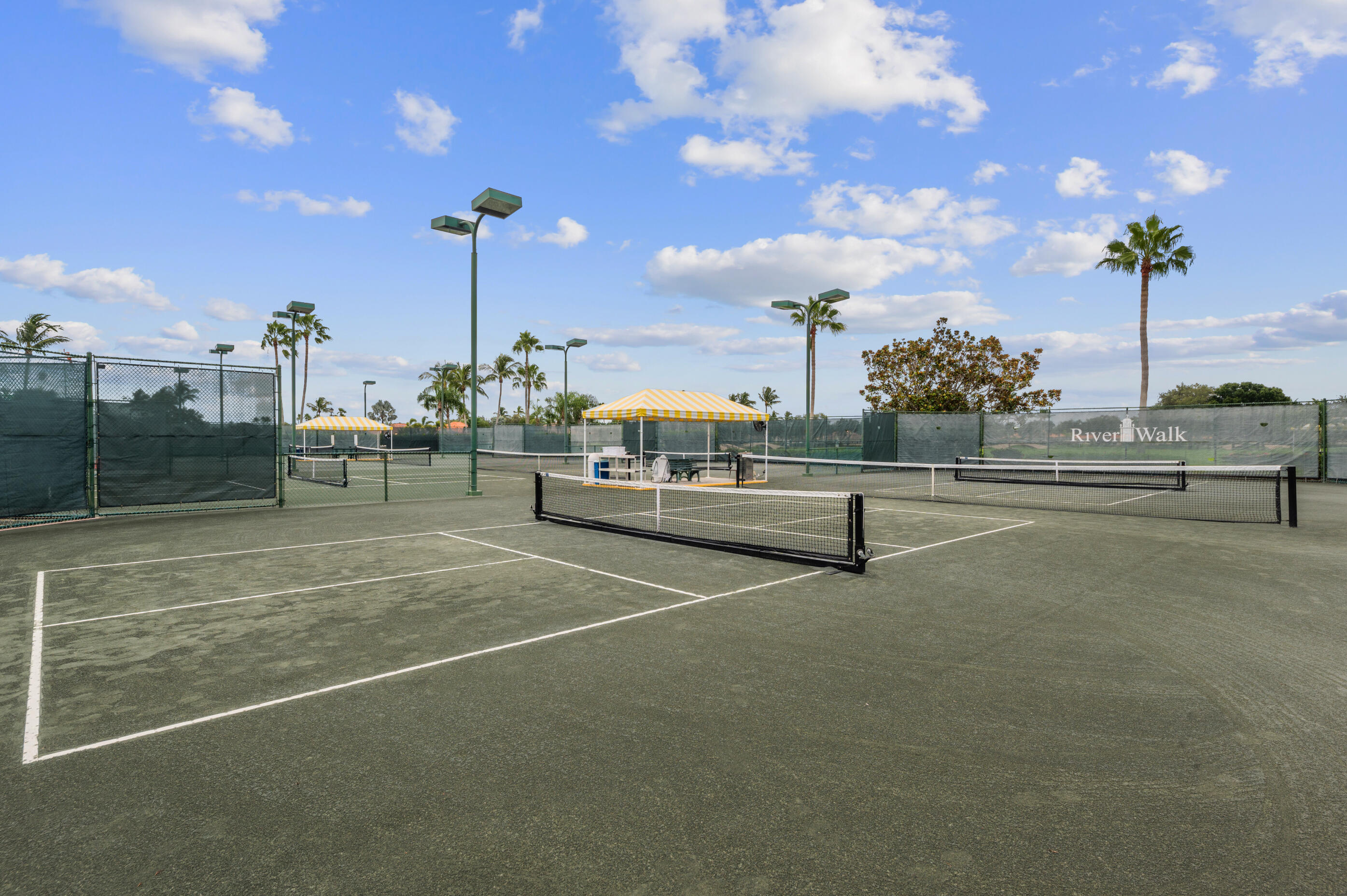 7718 Spring Creek Drive West Palm Beach, FL 33411 - Photo 61 of 72 a view of a tennis court