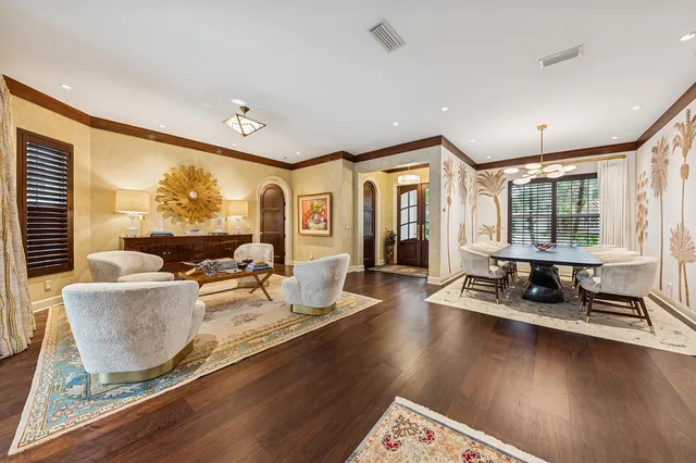 a kitchen with stainless steel appliances granite countertop a sink a stove and a wooden floors