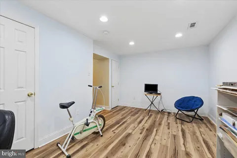 a bedroom with a bed and a book shelf