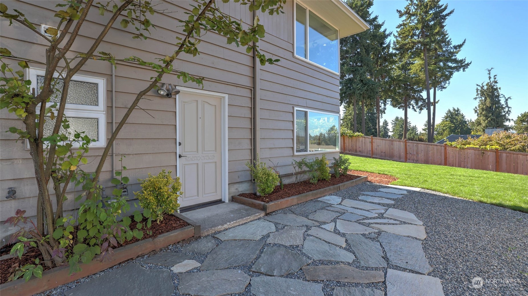 19801 Talbot Road South Renton, WA 98055 - Photo 19 of 20 a view of a back yard with a house