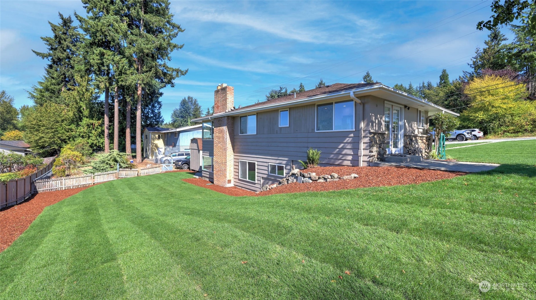 19801 Talbot Road South Renton, WA 98055 - Photo 20 of 20 a view of a house with a yard porch and sitting area