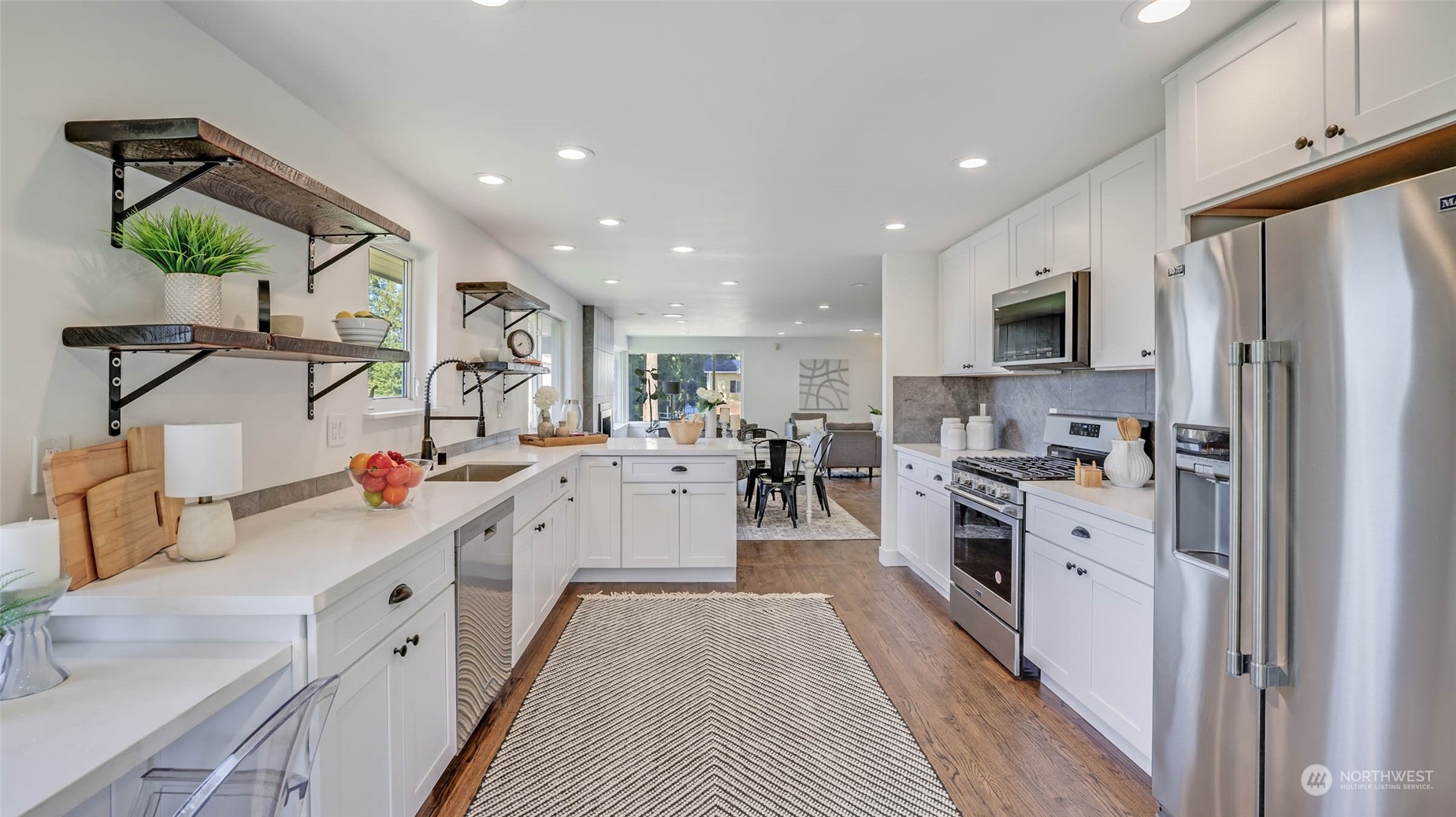 19801 Talbot Road South Renton, WA 98055 - Photo 6 of 20 a large kitchen with stainless steel appliances lots of counter space and a sink