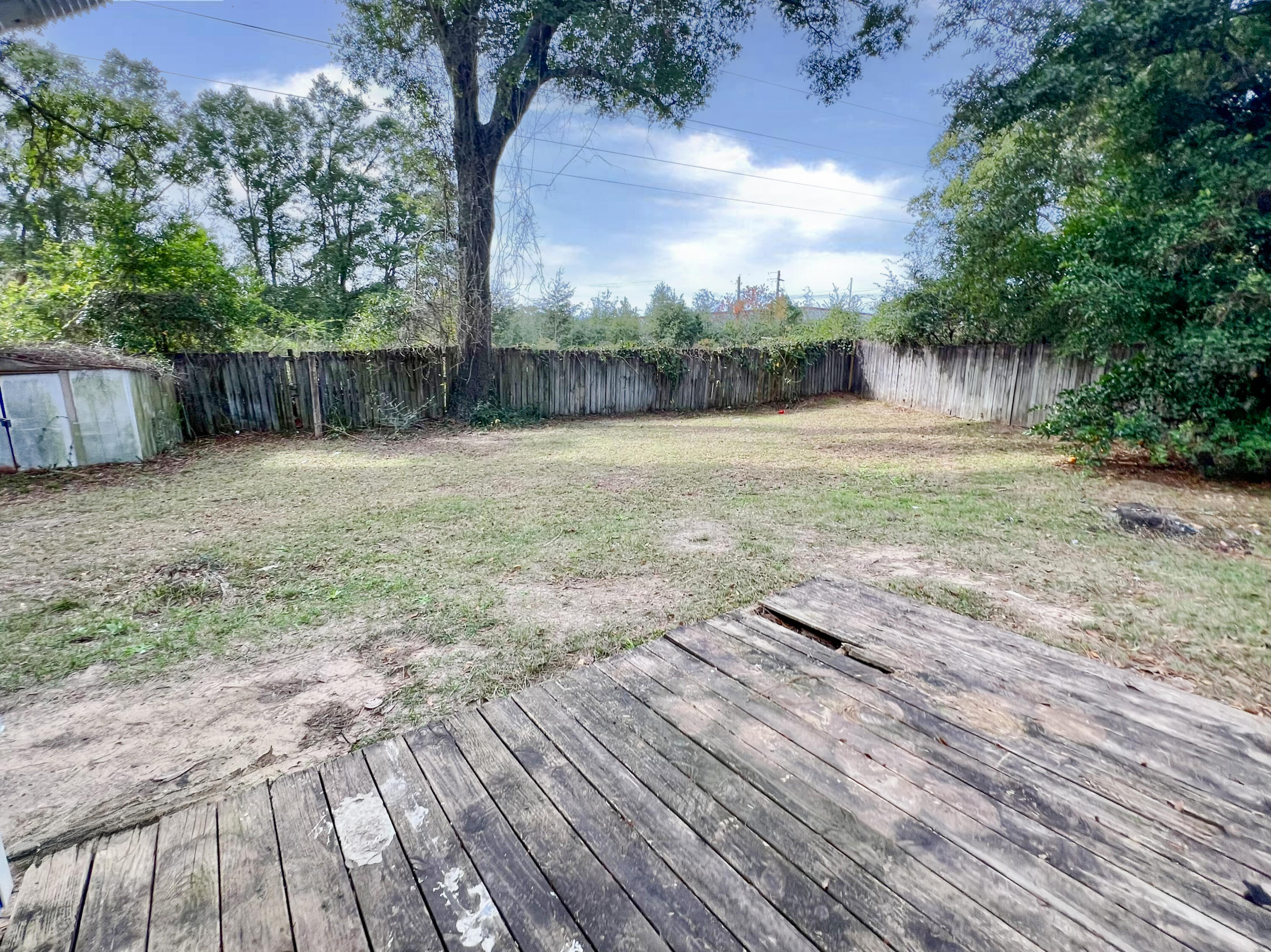 401 Cornwall Circle Pensacola, FL 32514 - Photo 14 of 20 a backyard of a house with lots of green space