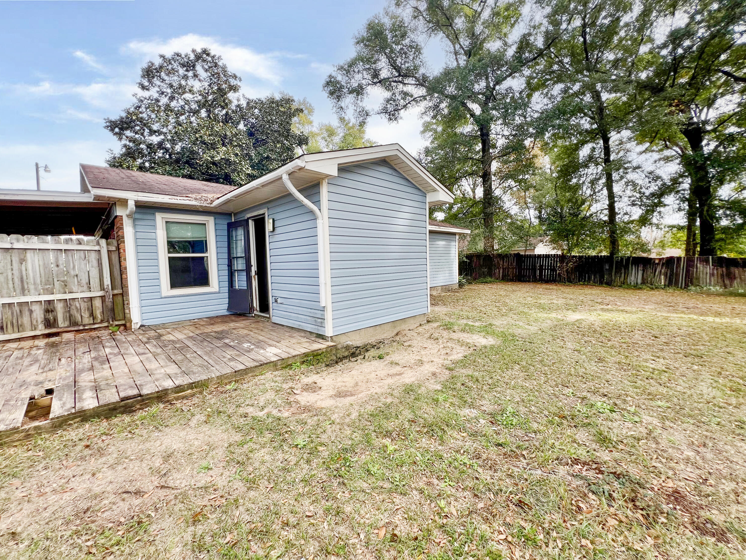 401 Cornwall Circle Pensacola, FL 32514 - Photo 17 of 20 a view of a house with a yard and garage