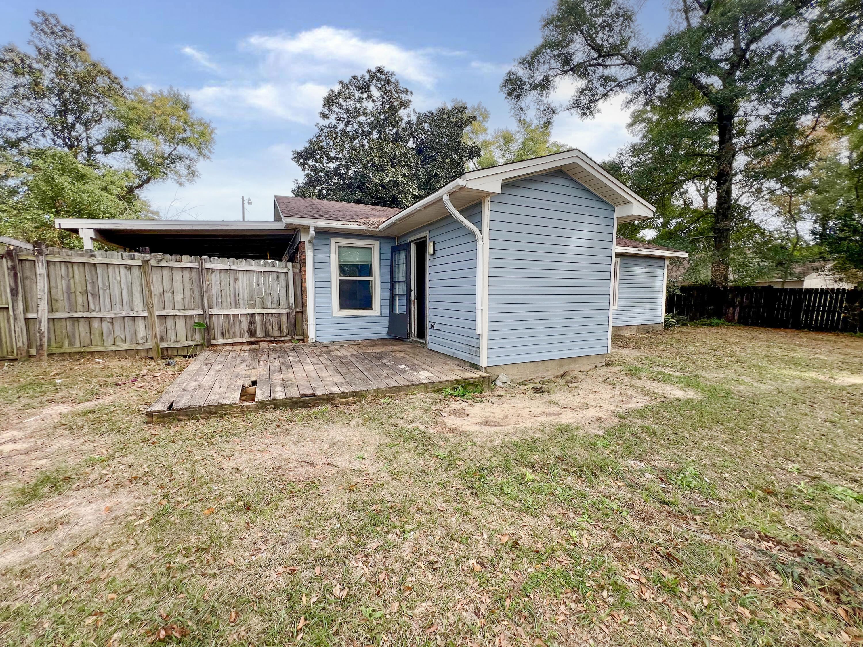 401 Cornwall Circle Pensacola, FL 32514 - Photo 18 of 20 a view of a house with a yard and garage