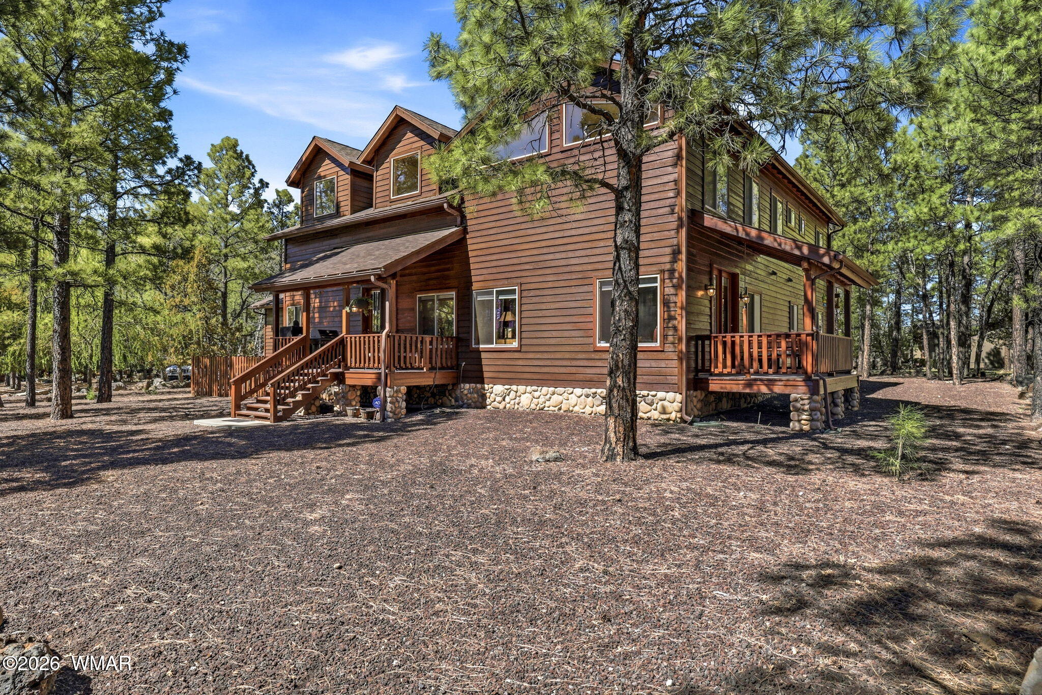826 Pine Creek Circle Lakeside, AZ 85929 - Photo 42 of 65 a view of a house with a yard and sitting area