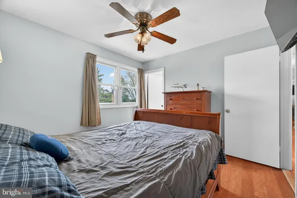 a view of a room with furniture and window