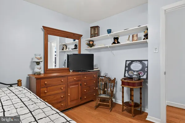 a bedroom with a bed and a chair