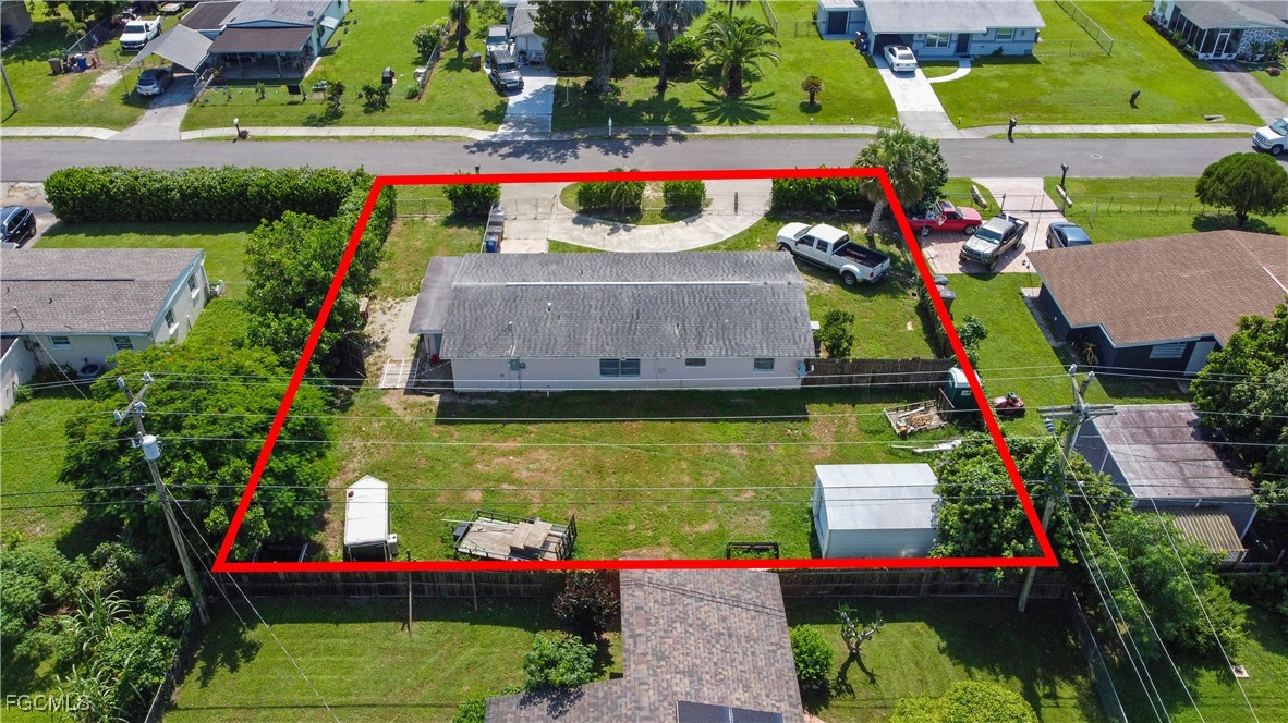 117 Texas Road Lehigh Acres, FL 33936 - Photo 14 of 19 a view of swimming pool with sitting area