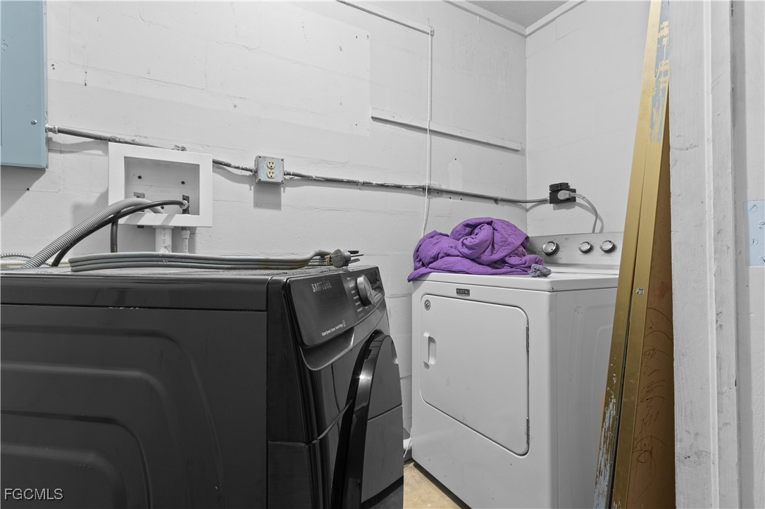 117 Texas Road Lehigh Acres, FL 33936 - Photo 17 of 19 a utility room with dryer and washer