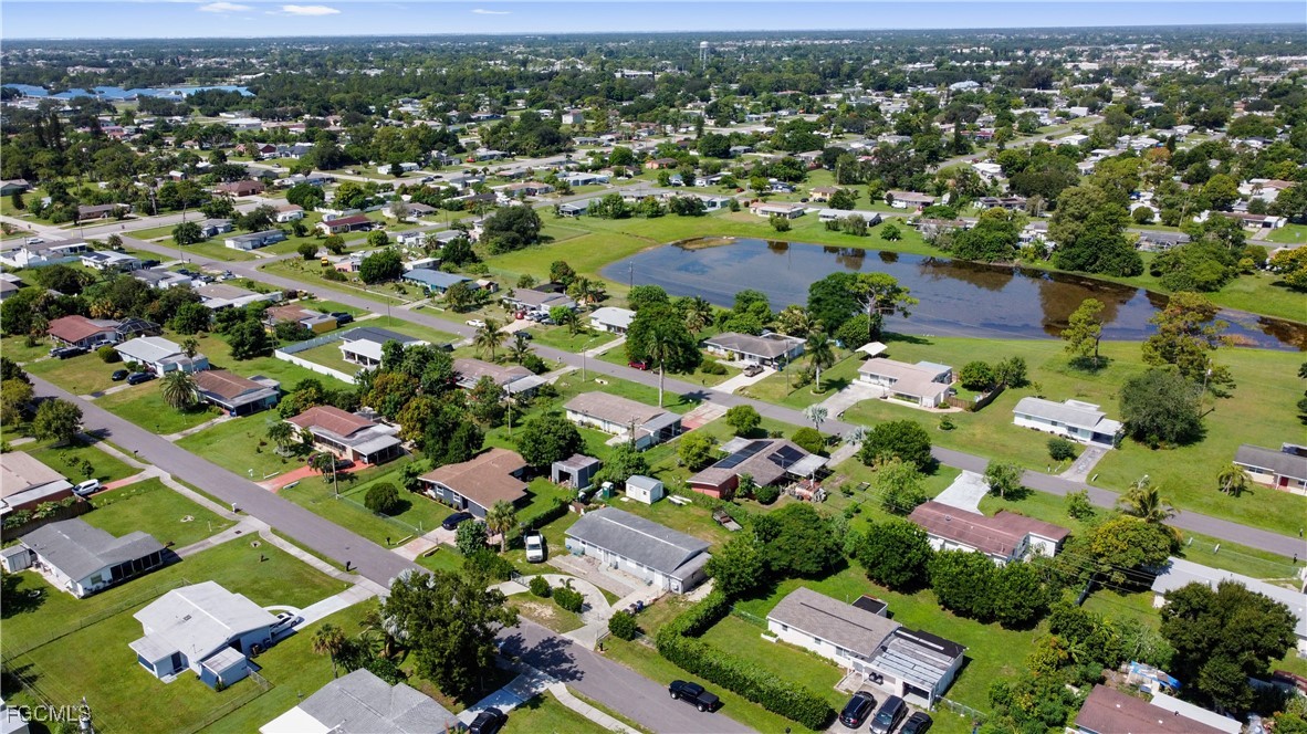 117 Texas Road Lehigh Acres, FL 33936 - Photo 19 of 19 an aerial view of residential houses with outdoor space
