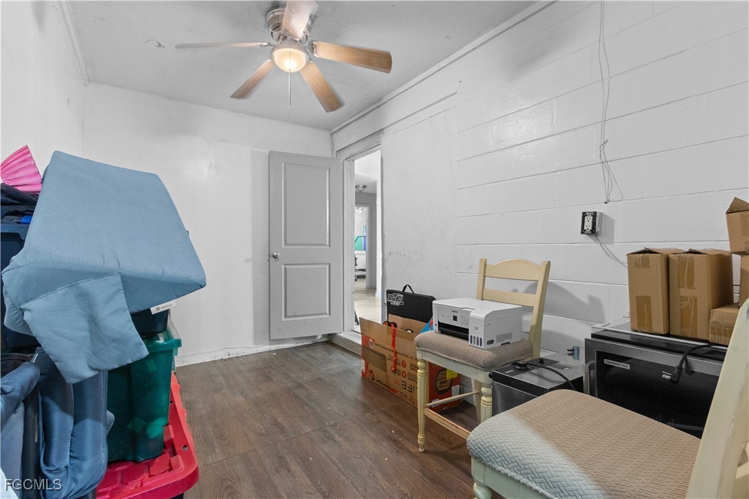117 Texas Road Lehigh Acres, FL 33936 - Photo 10 of 19 a living room with furniture and a wooden floor