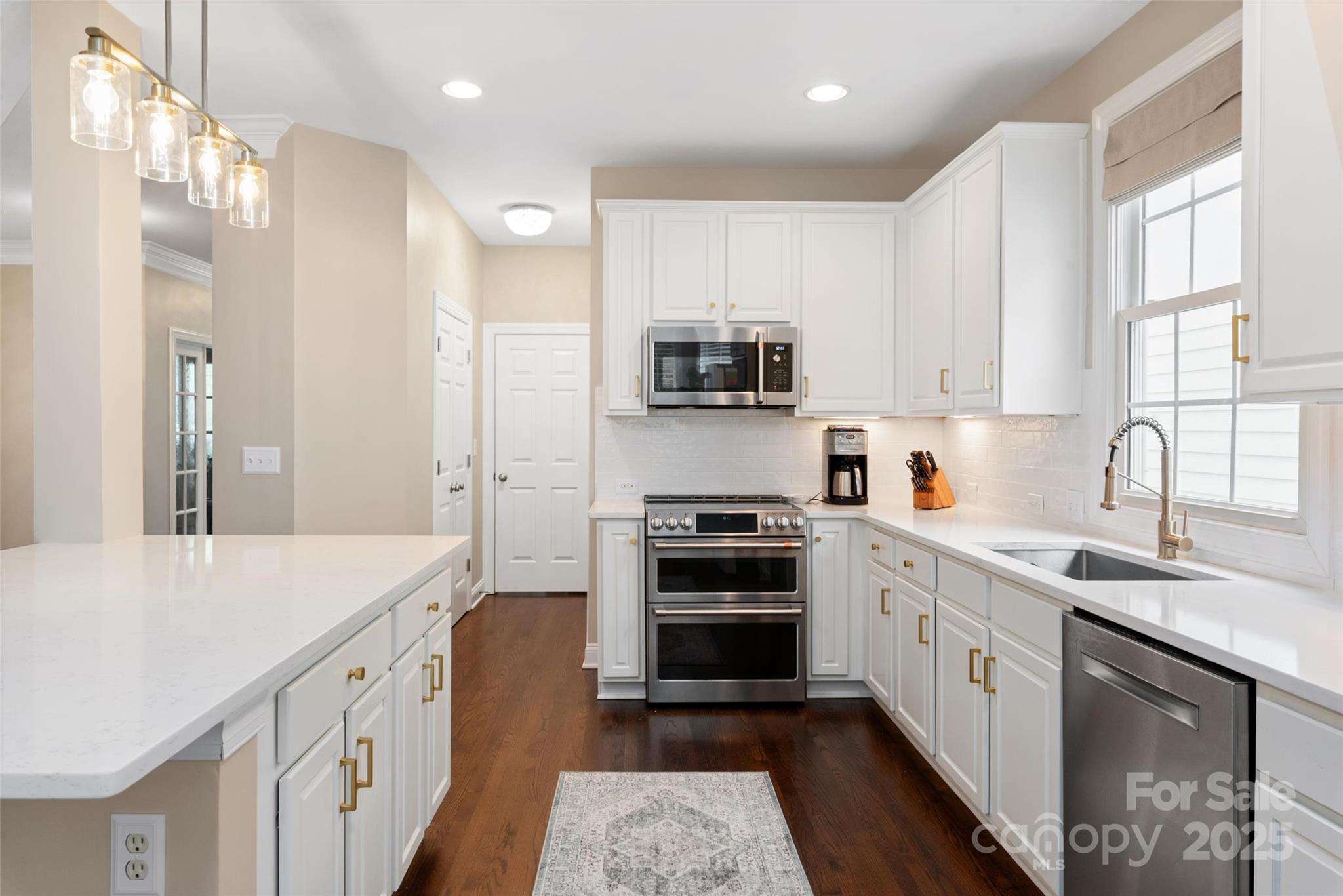 875 Stratford Run Drive Fort Mill, SC 29708 - Photo 7 of 37 a kitchen with stainless steel appliances granite countertop a sink stove and refrigerator