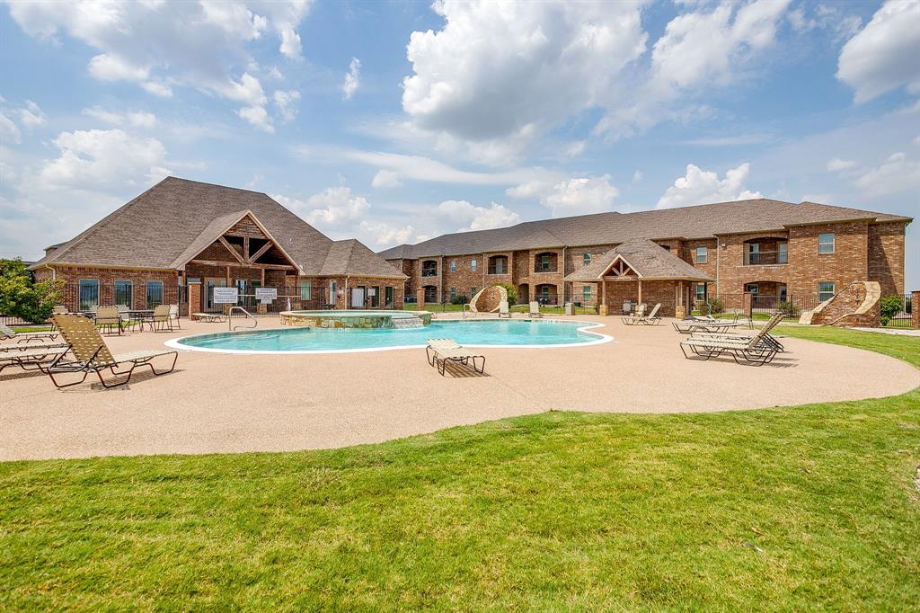 301 County Road 207, Unit 1206 Alvarado, TX 76009 - Photo 27 of 30 a swimming pool with outdoor seating and yard