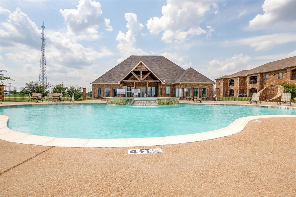 301 County Road 207, Unit 1206 Alvarado, TX 76009 - Photo 29 of 30 a view of a house next to a lake with a big yard and large trees