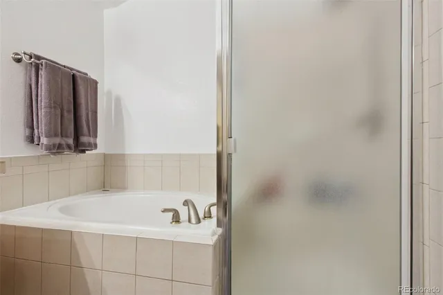 a bathroom with a bathtub and a sink