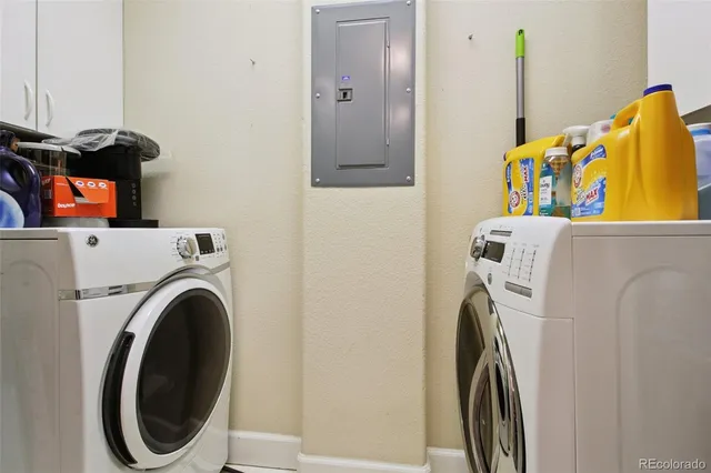a view of a chairs and table in the balcony