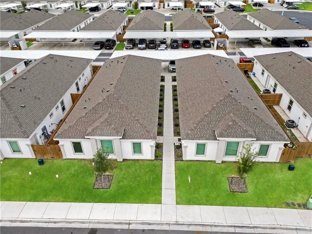 a aerial view of a house with a yard