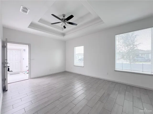 a view of a kitchen with a refrigerator cabinets and a window