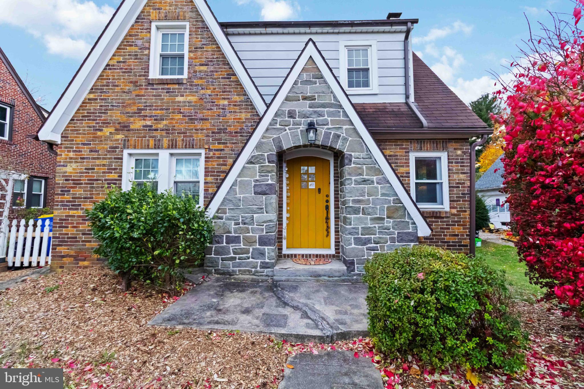 1840 South Queen Street York, PA 17403 - Photo 4 of 37 Charming brick home with vibrant yellow door.