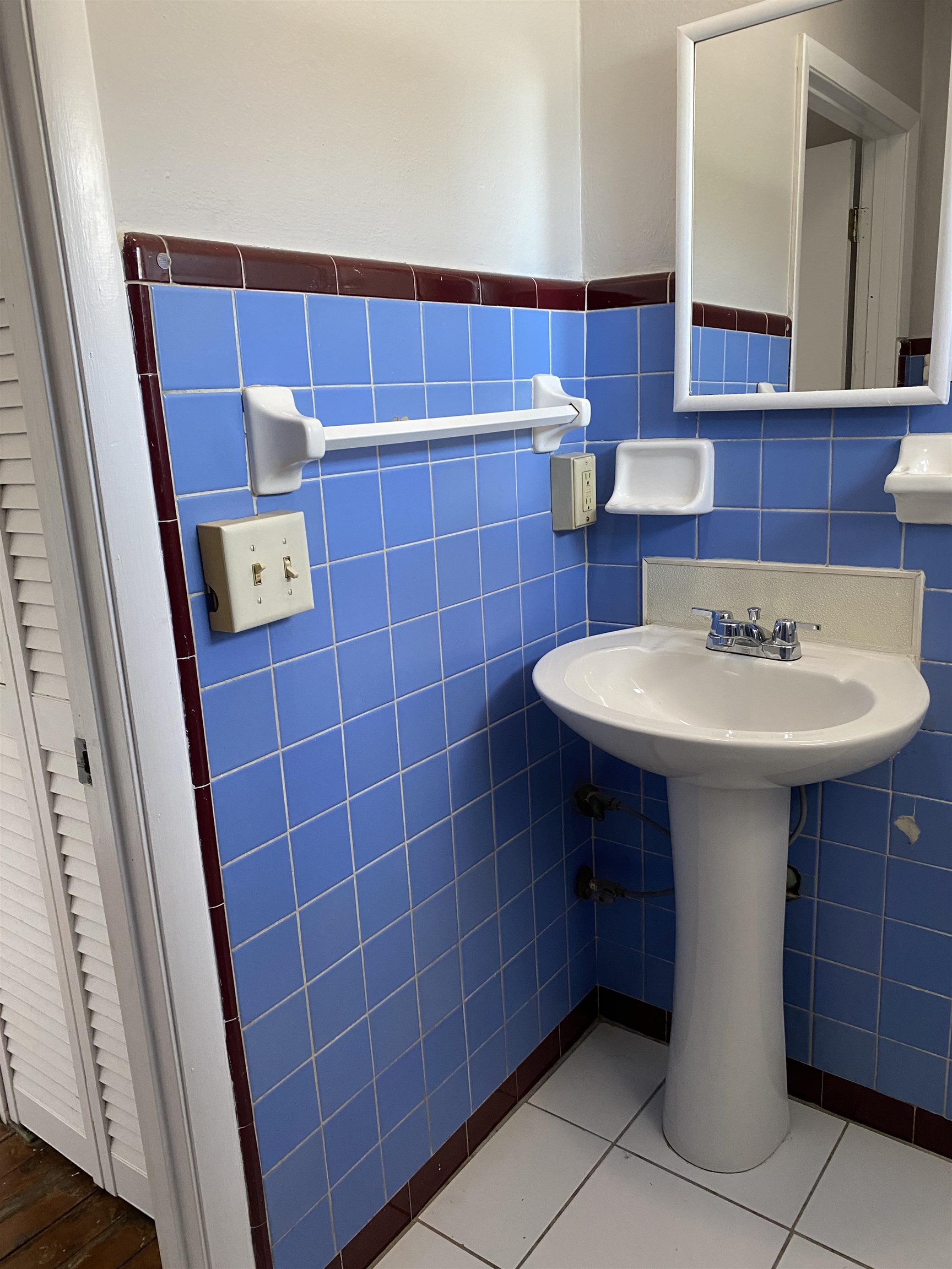 147 Riberia Street, Unit D St. Augustine, FL 32084 - Photo 11 of 19 a bathroom with a sink and a mirror